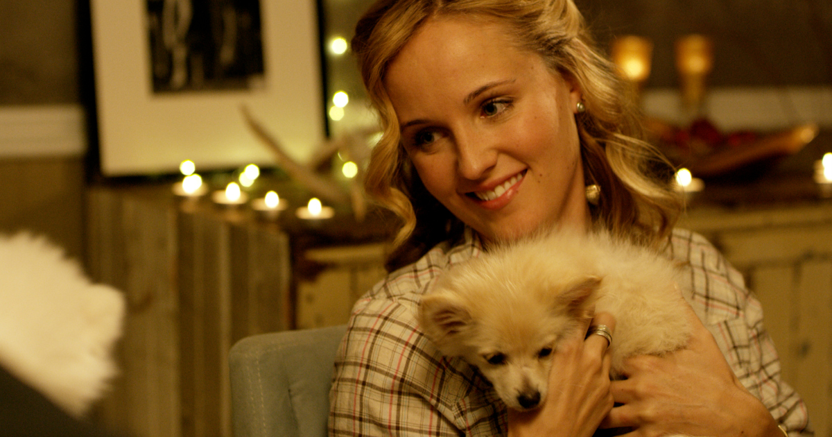 blonde woman with little white dog