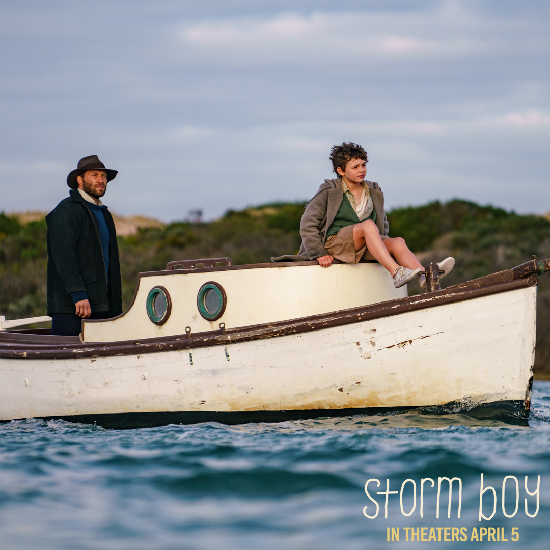 man and boy on a boat