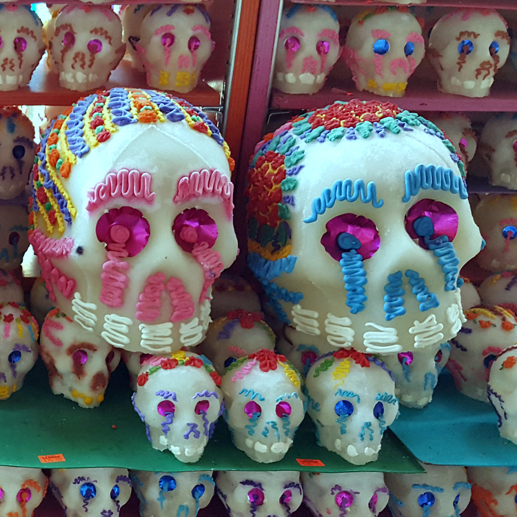 pink and blue sugar skull display