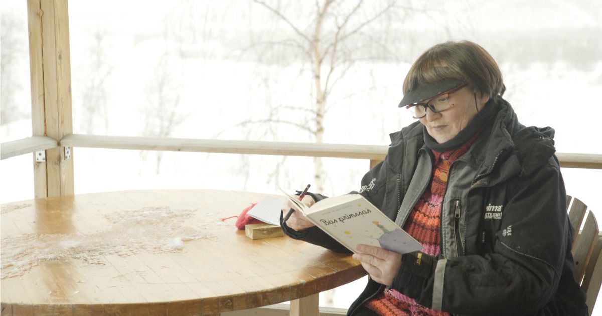 woman reading on a snowy day