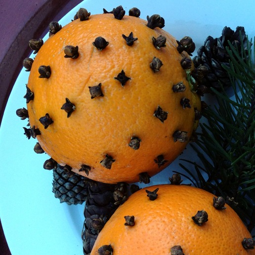 orange with cloves stuck in it