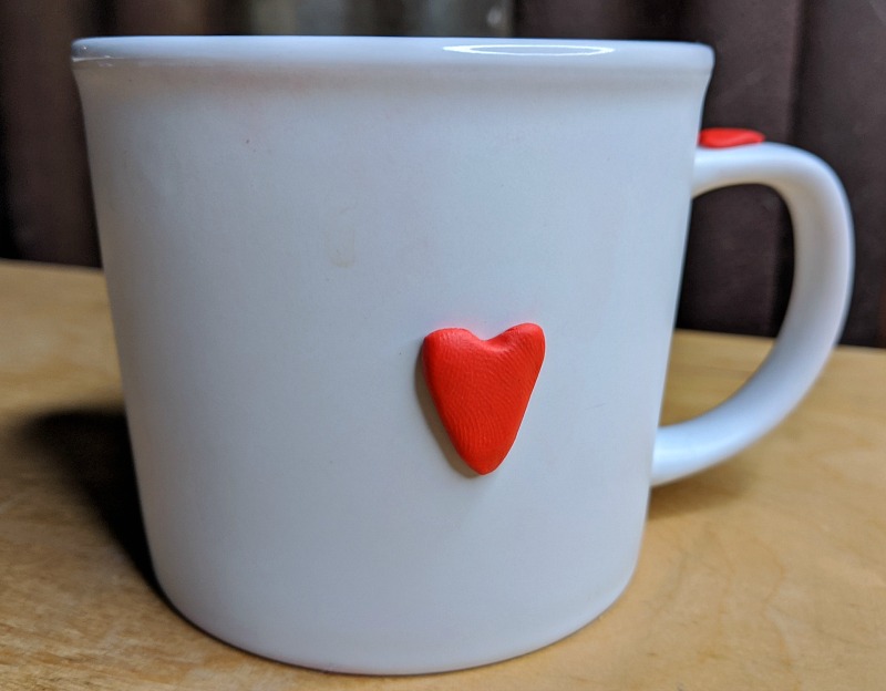 white mug with heart design