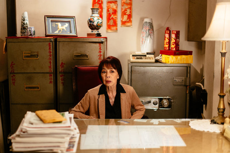 woman sitting at desk in old office