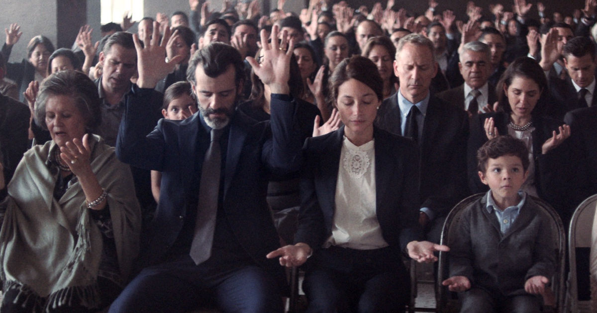 audience praying in church