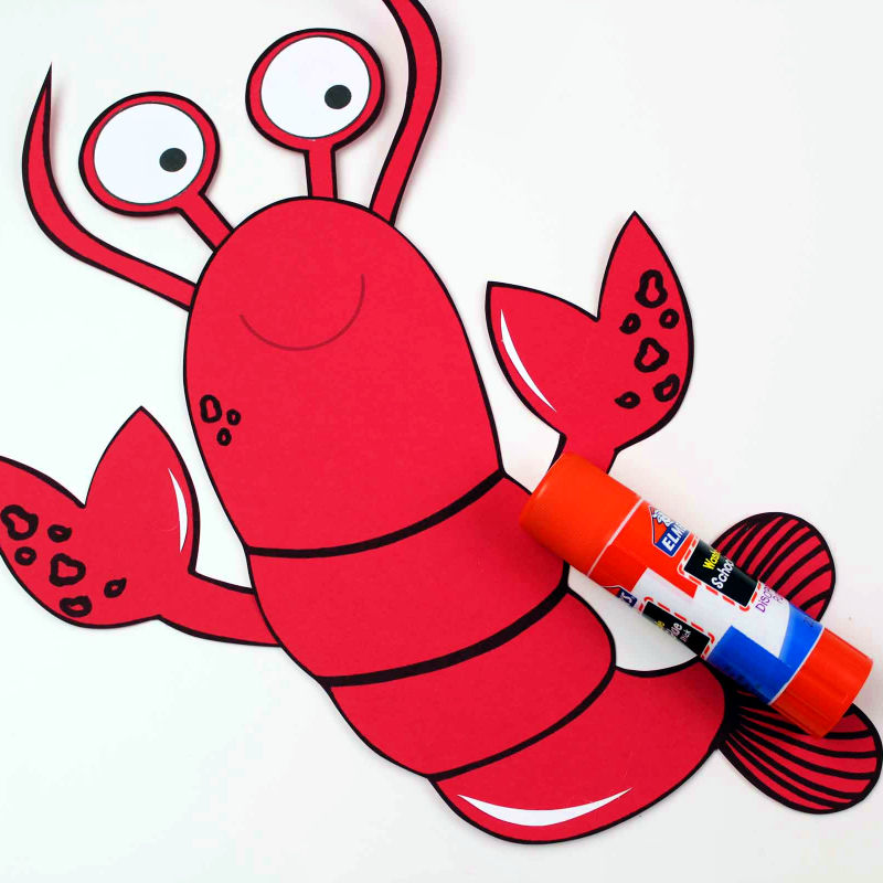 gluing lobster paper craft together