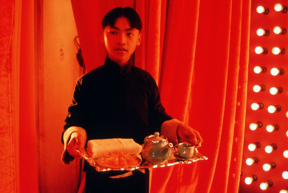 chinese boy serving tea