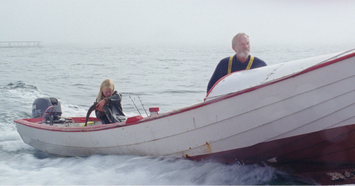 grandpa and granddaughter in boat