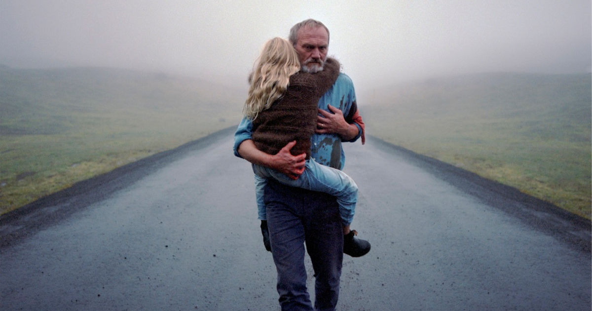 man carrying granddaughter