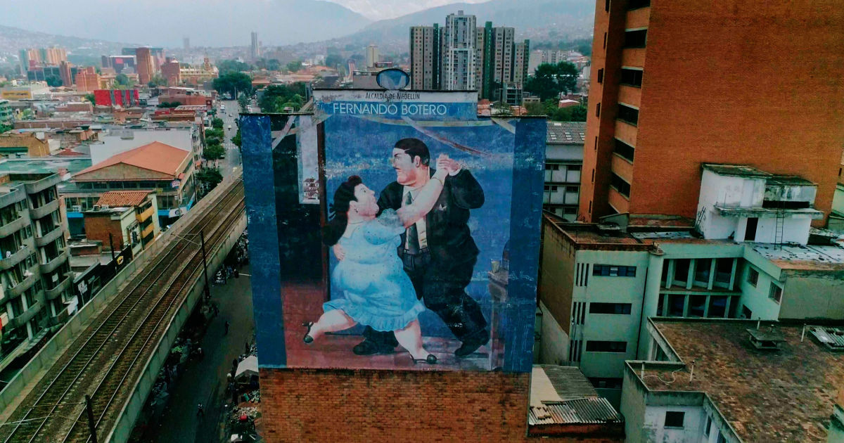 mural of dancers on city building