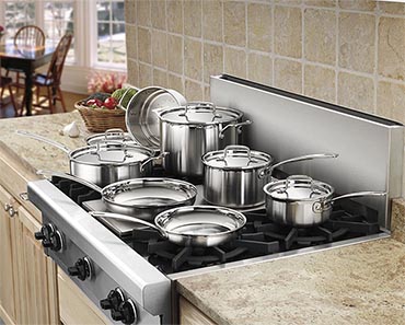 cuisinart cookware on a 6 burner gas stove.