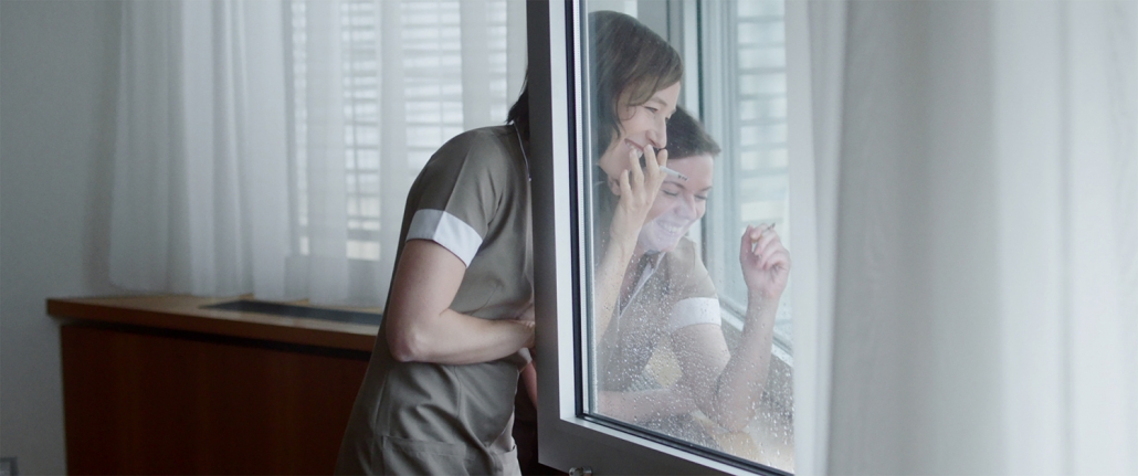 women smoking and laughing.