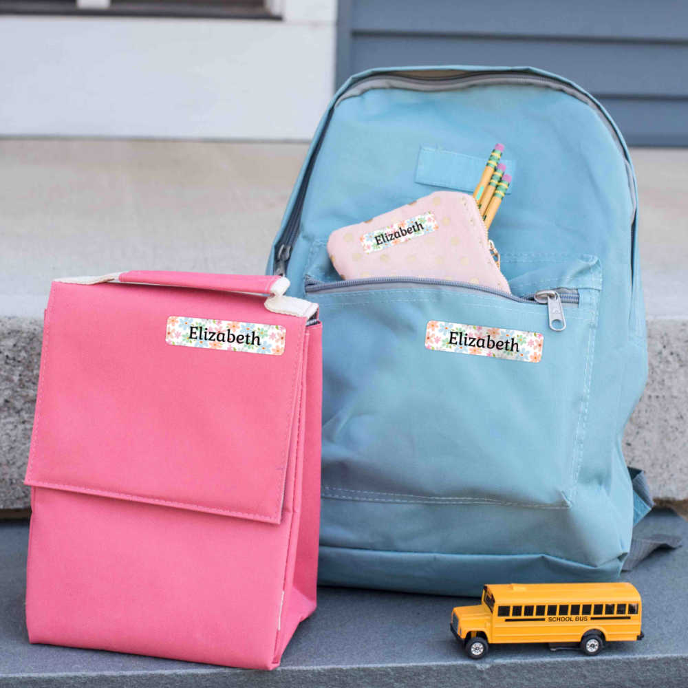 lunch bag and backpacks with name bubble labels