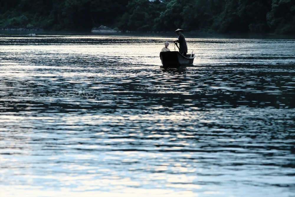 two people on small japanese fishing boat