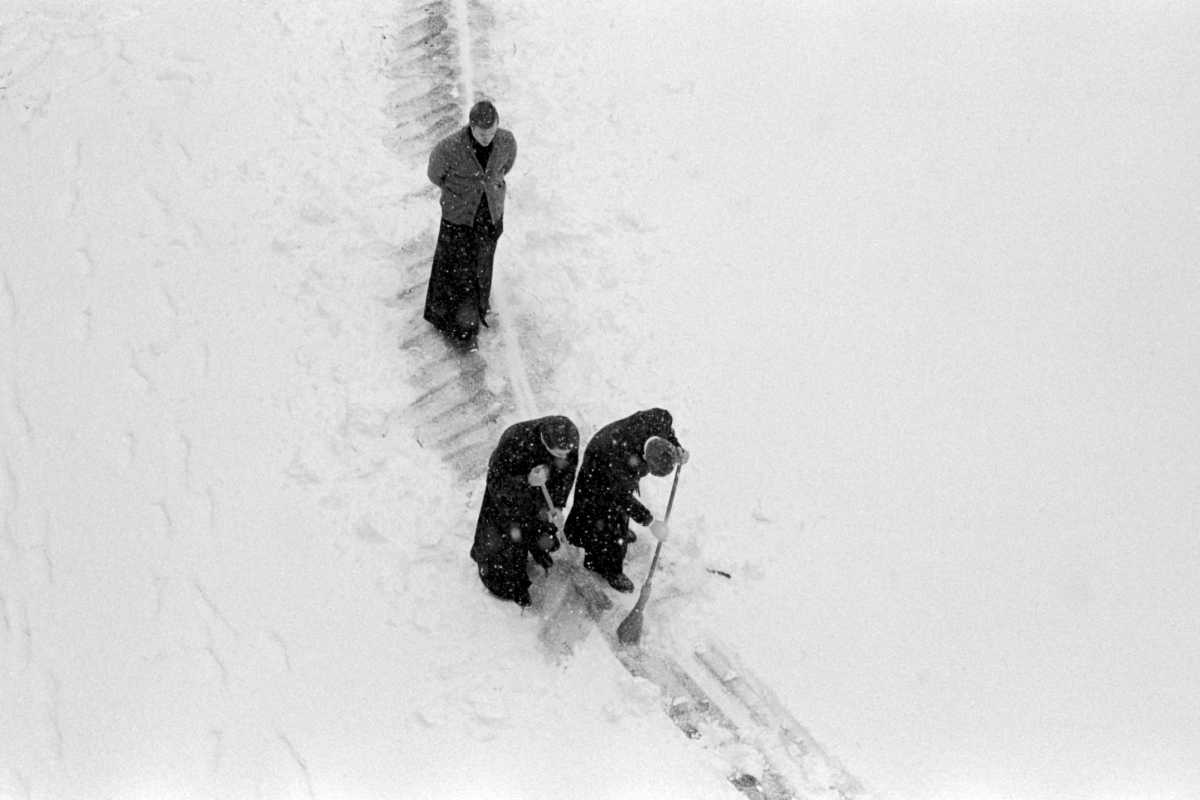 clergy clearing path in snow