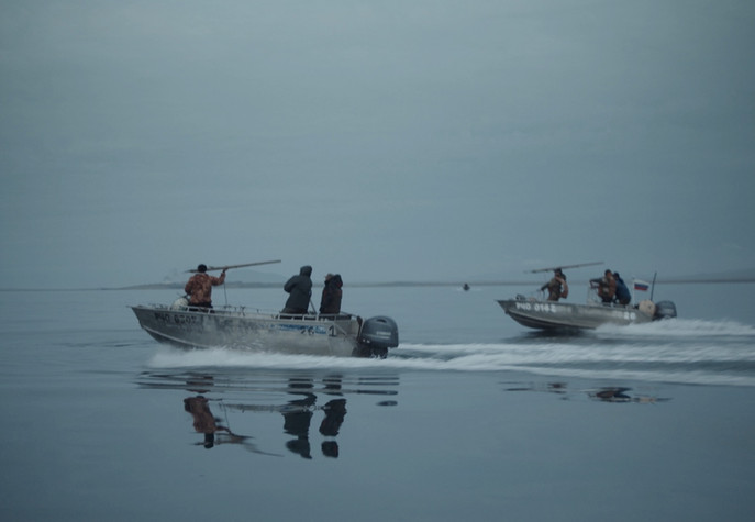 whalers on small boats