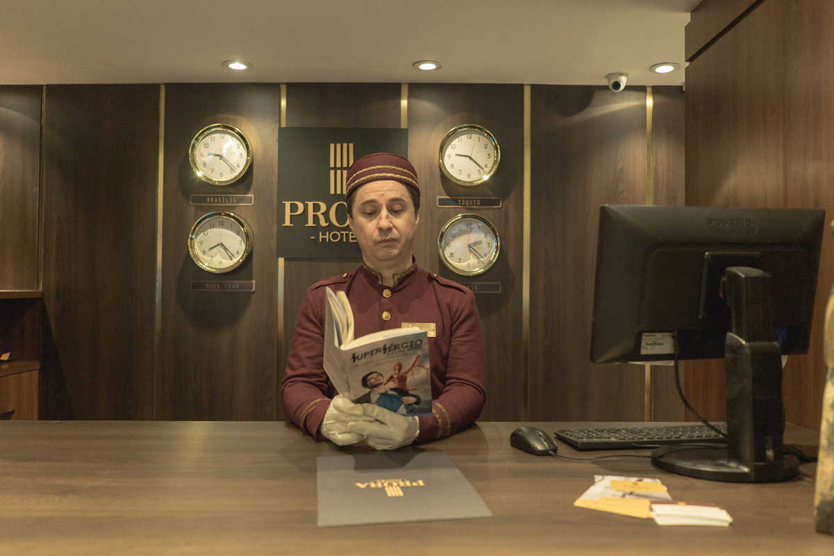 bellhop reading at desk