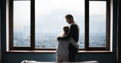 couple looking out window