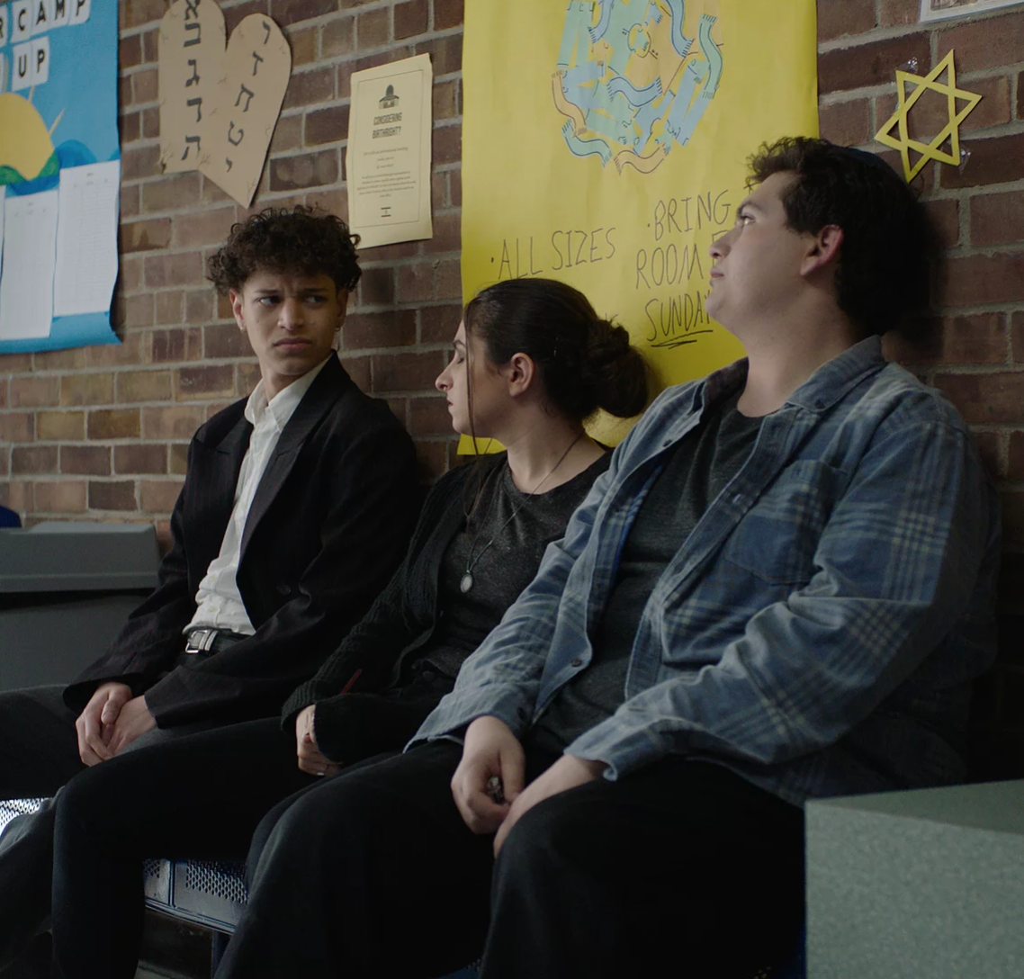 students sitting in hallway