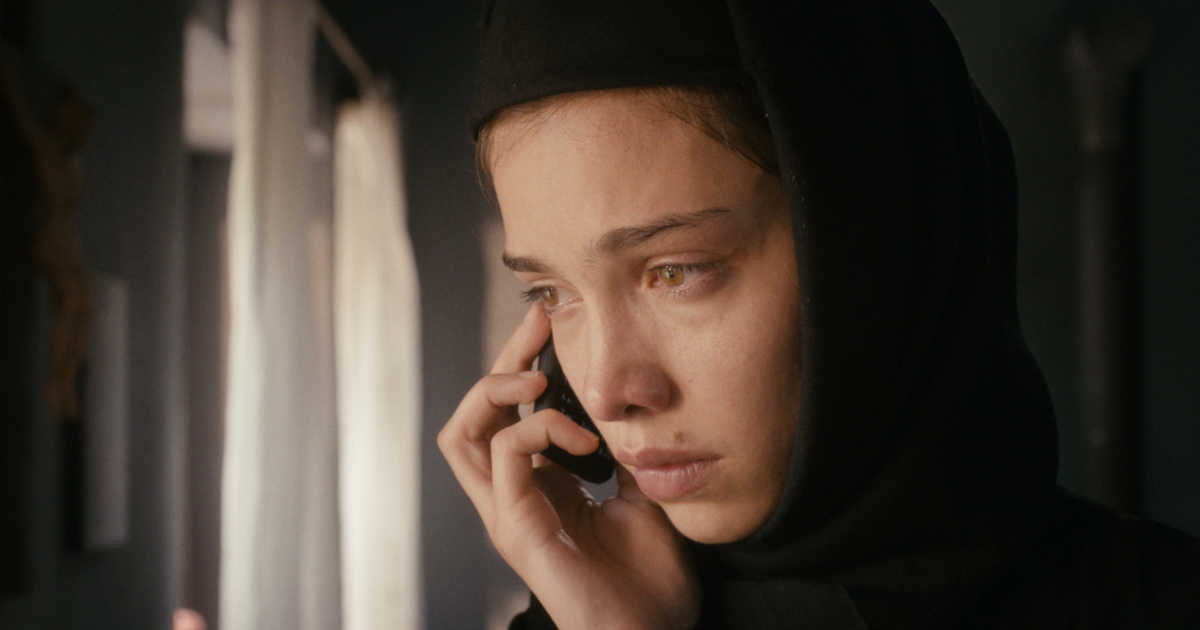religious woman listening to phone
