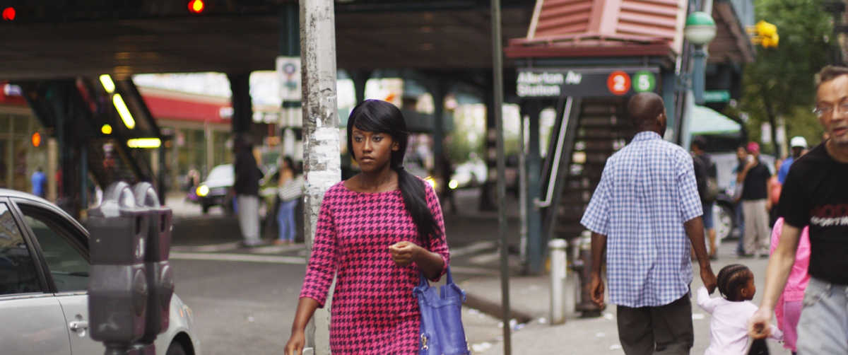 new york street scene in queen of glory