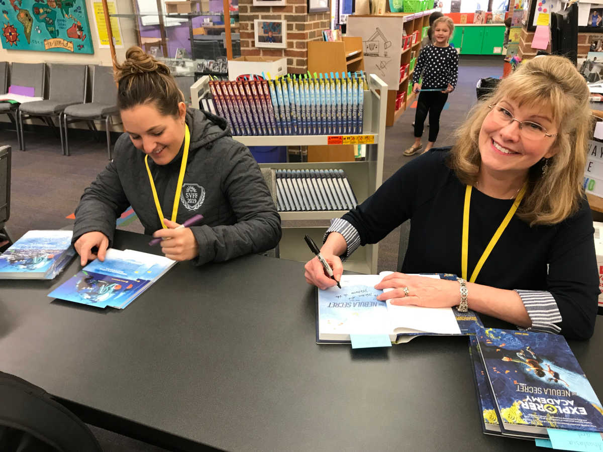 Trudi and Erika sign books for readers at Western Avenue Elementary in Geneva, IL