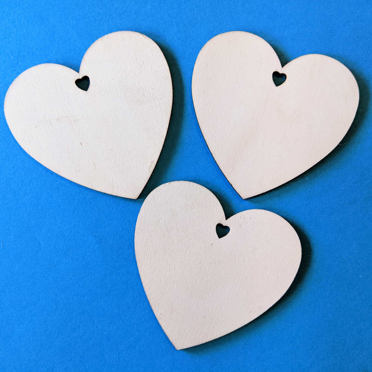 3 unfinished wood hearts