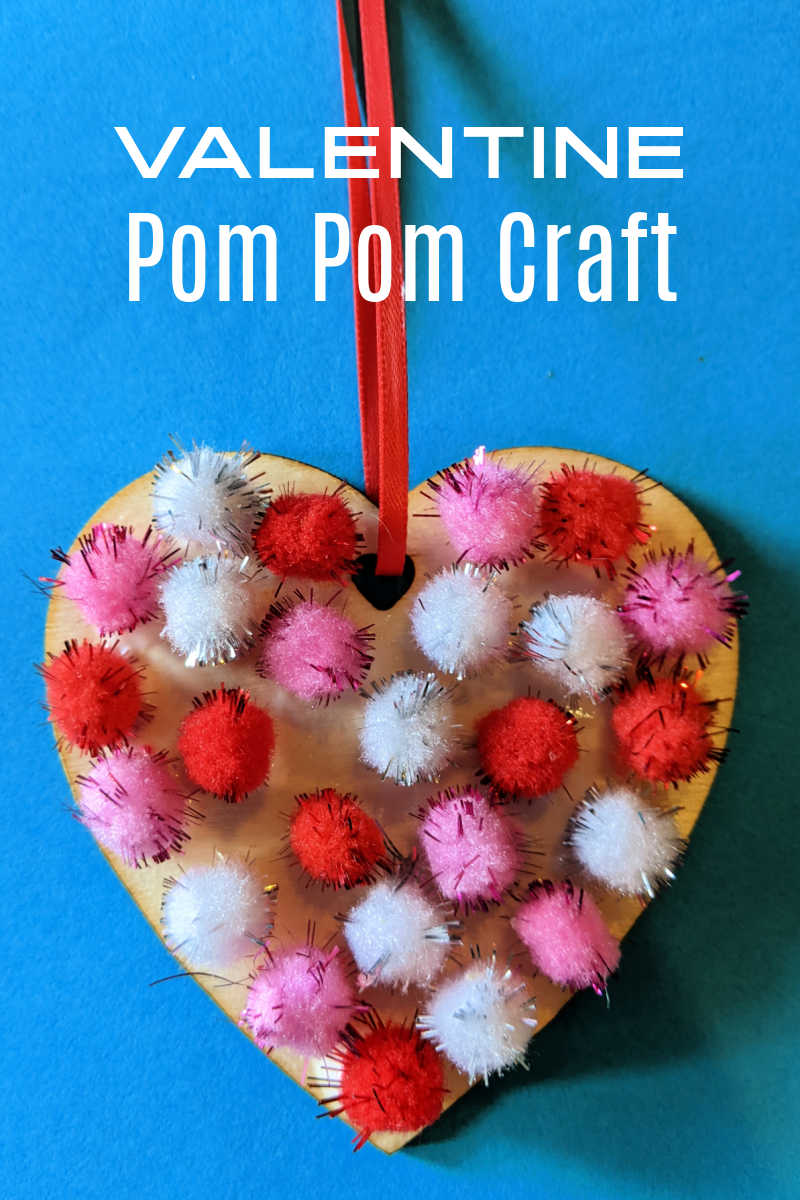 Kids and adults can make a Valentine pom pom craft heart to give to someone special or to use as a holiday decoration. 