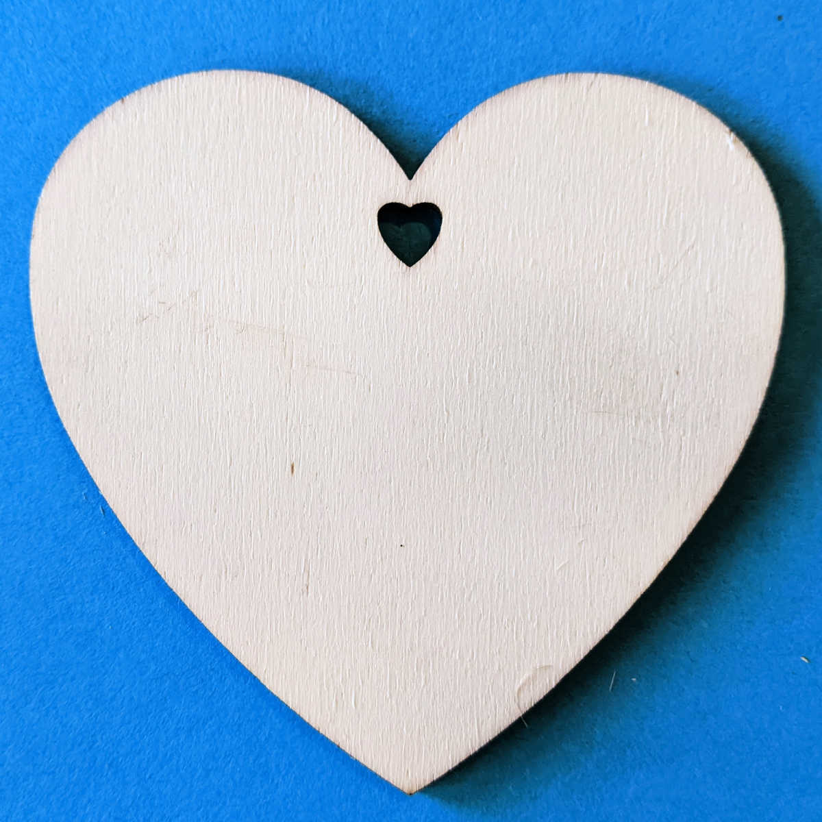 unfinished wood heart with hole