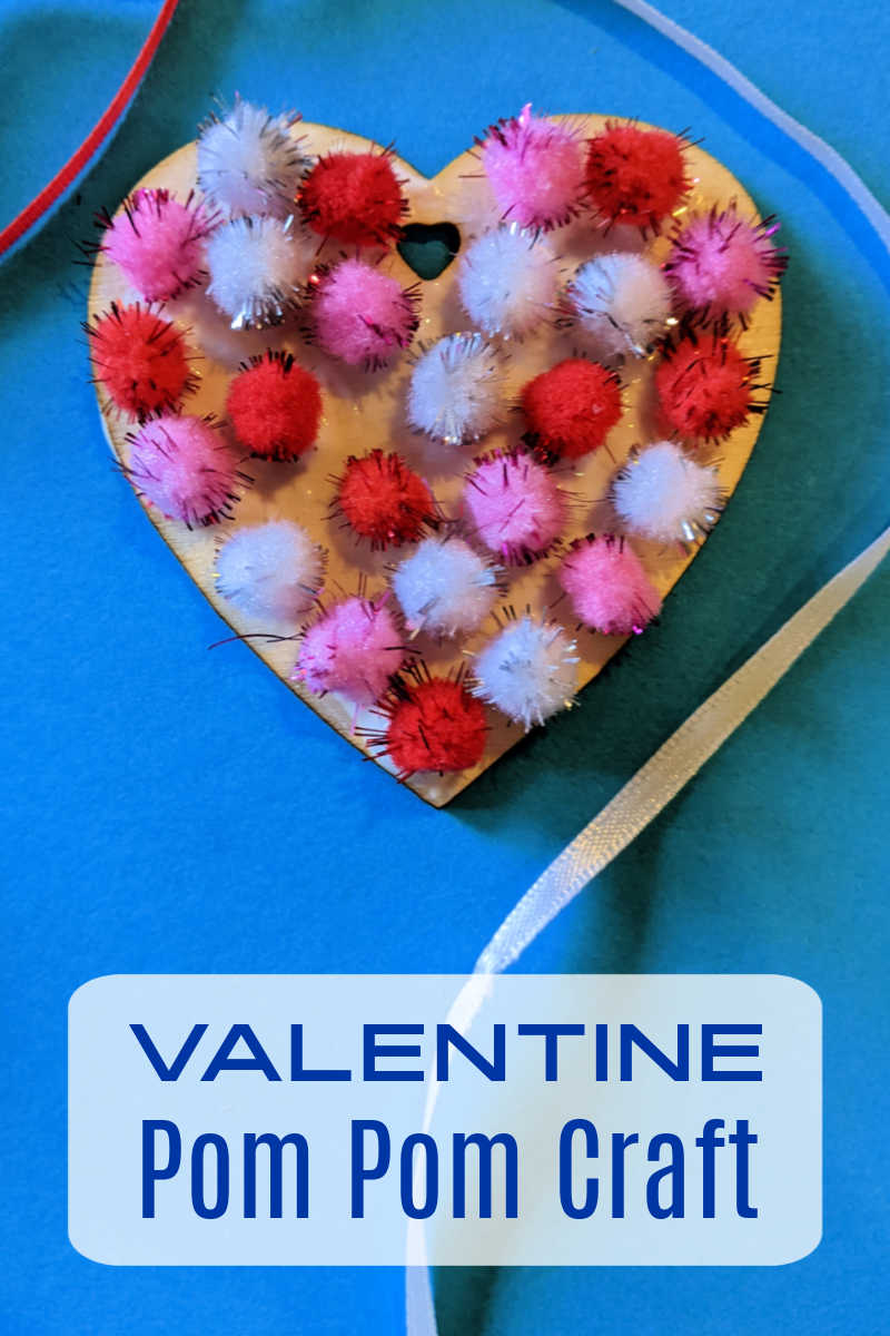 Kids and adults can make a Valentine pom pom craft heart to give to someone special or to use as a holiday decoration. 