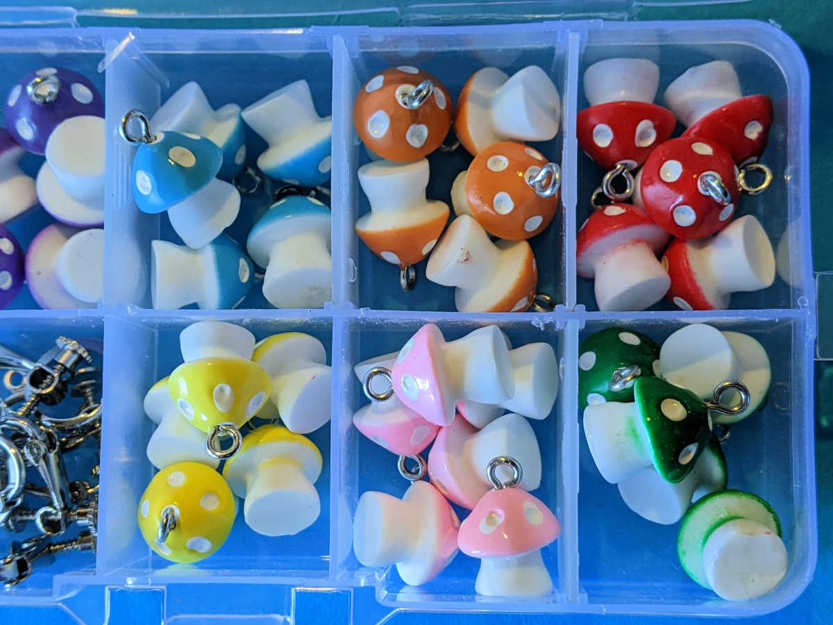 box of resin mushroom charms