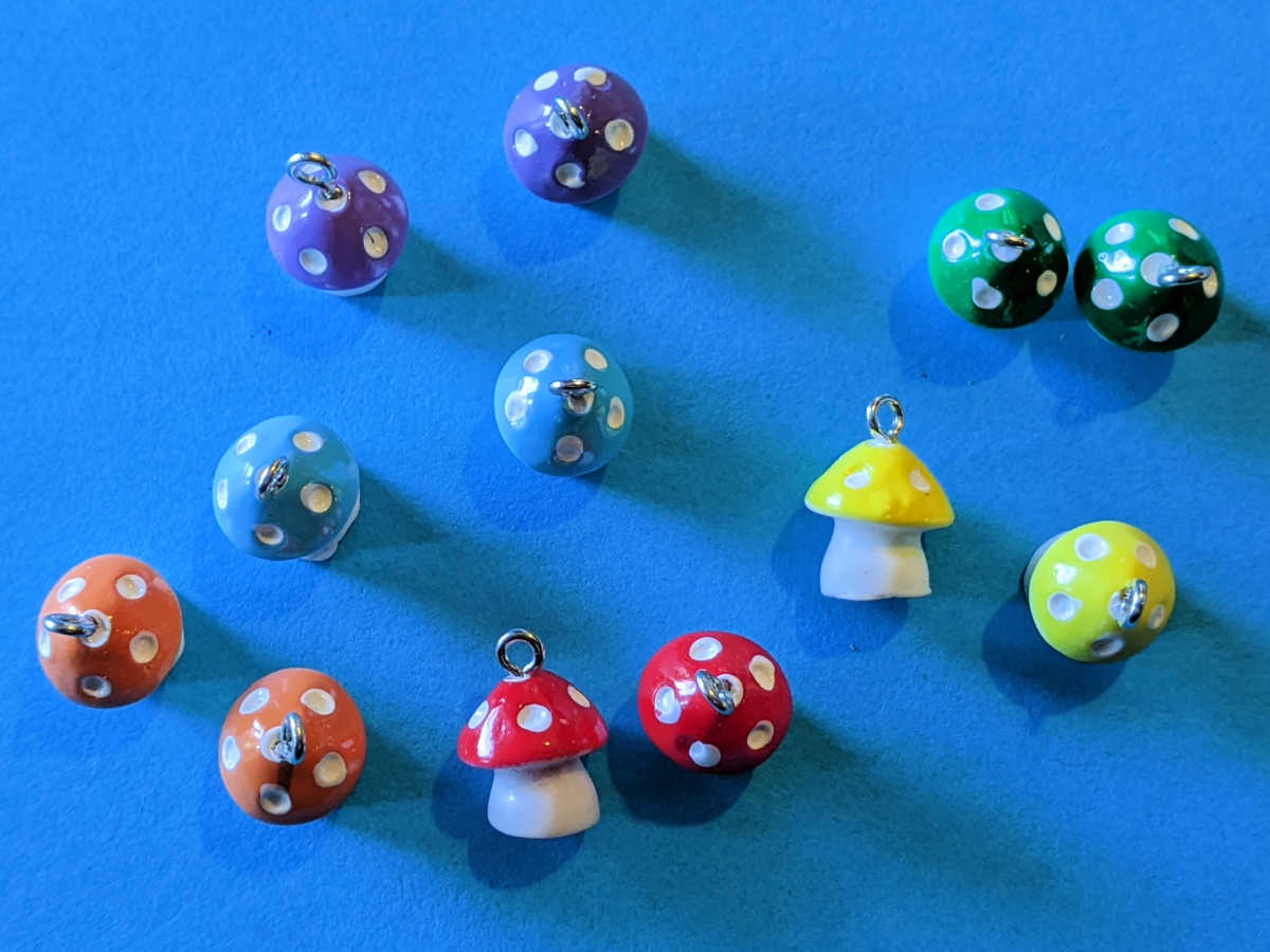 mushroom charms in rainbow colors