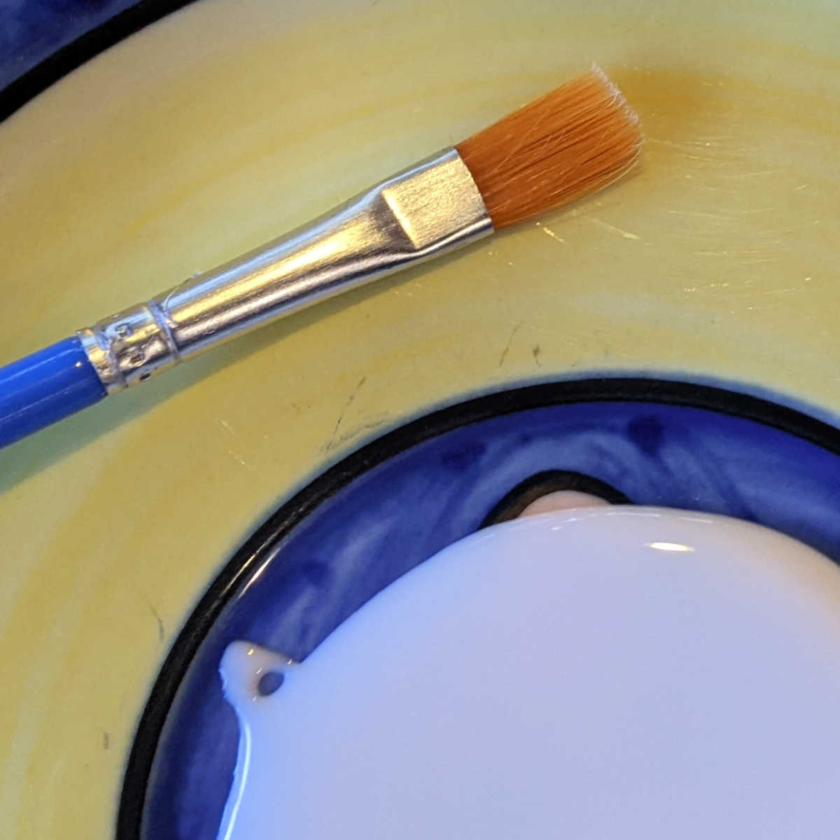 paintbrush and white glue