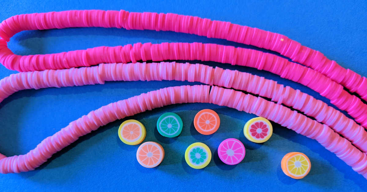 pink heishi beads and fruit design beads