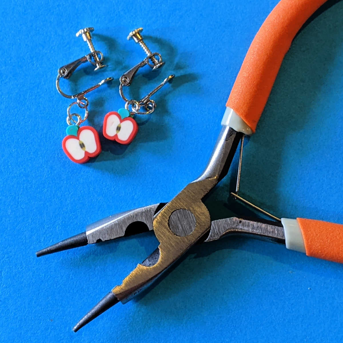 pliers with apple clip-on earrings