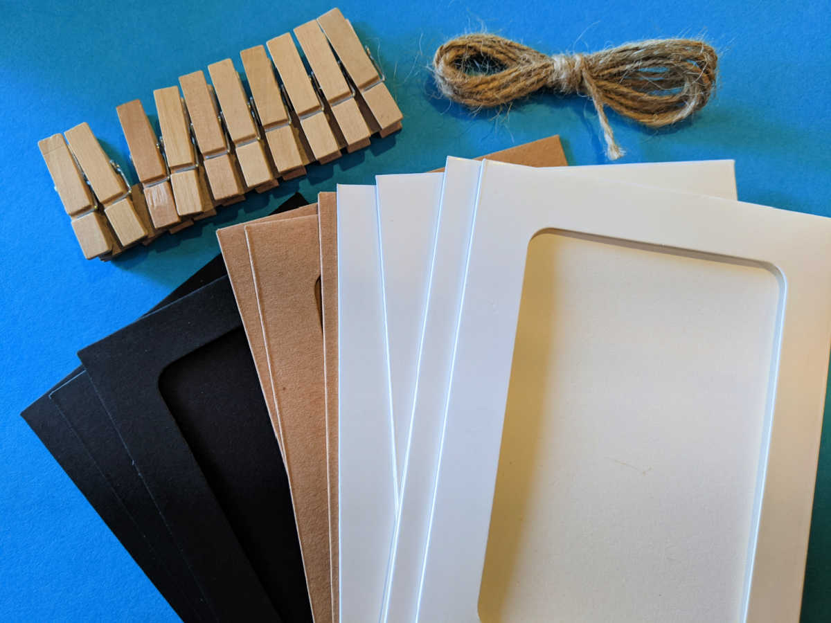 set of paper picture frames clothespins and twine