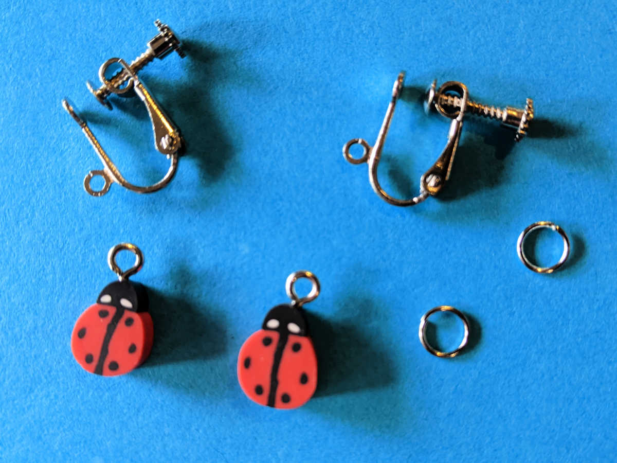 supplies for clip-on ladybug earrings