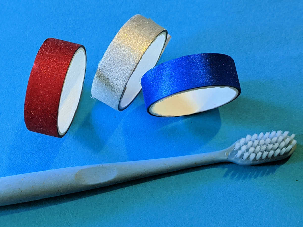 washi tape rolls and toothbrush