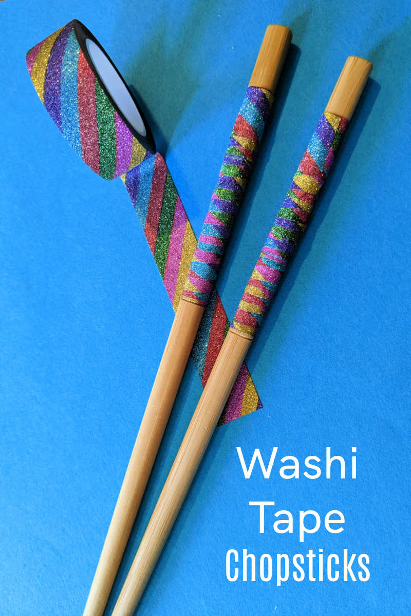 Looking for a fun and easy craft to do with your kids? Look no further than this rainbow washi tape chopsticks craft!
