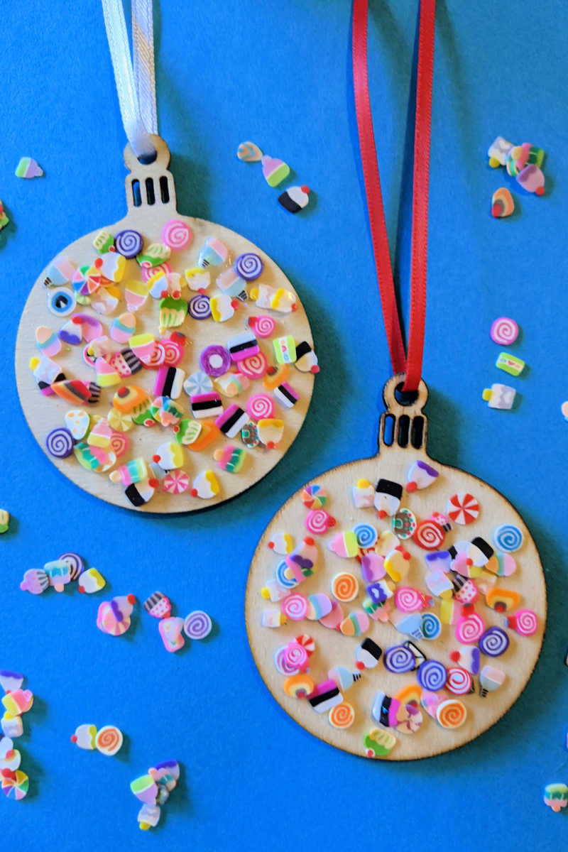 Making a festive wood Christmas candy ornament with polymer clay candy slices and unfinished wood ornaments is an easy and fun craft activity.