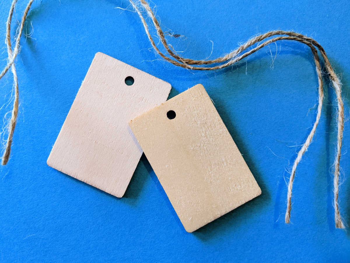 two wood gift tags with twine