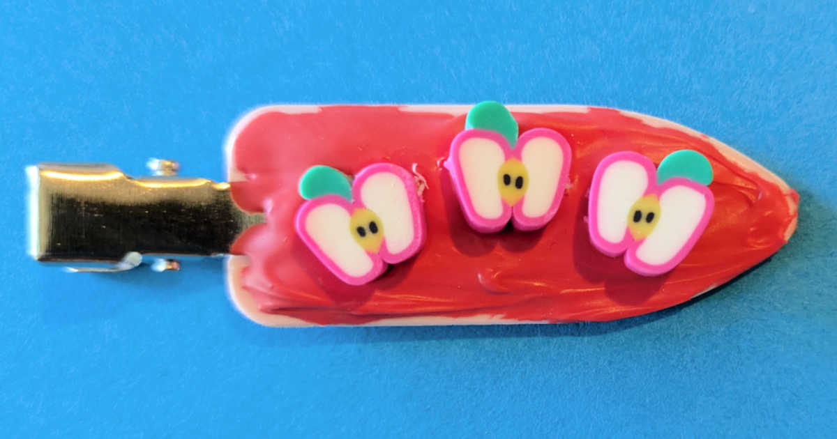 red cream glue apple hair clip