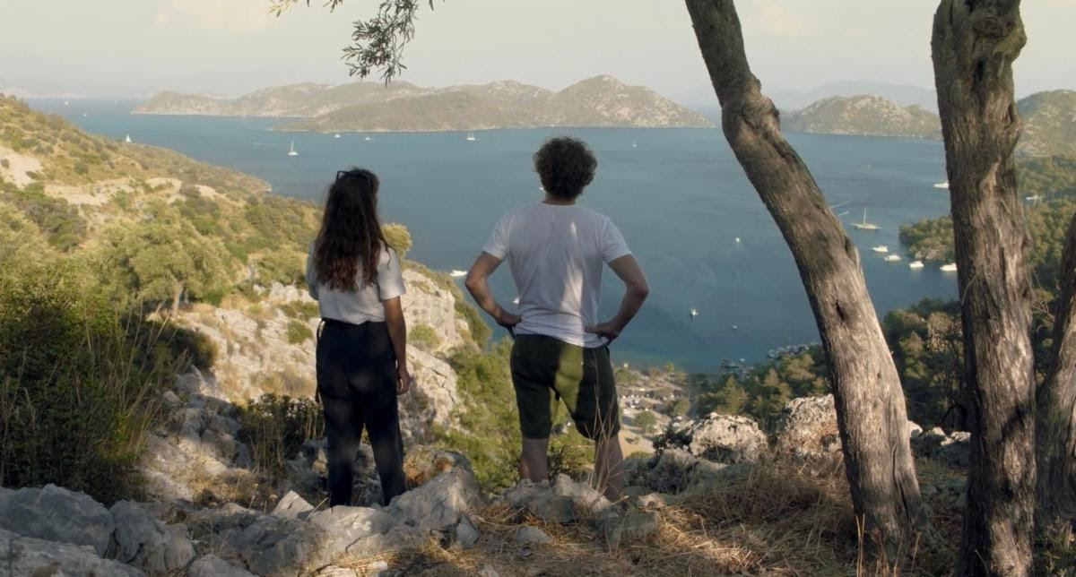 couple looking out at aegean sea