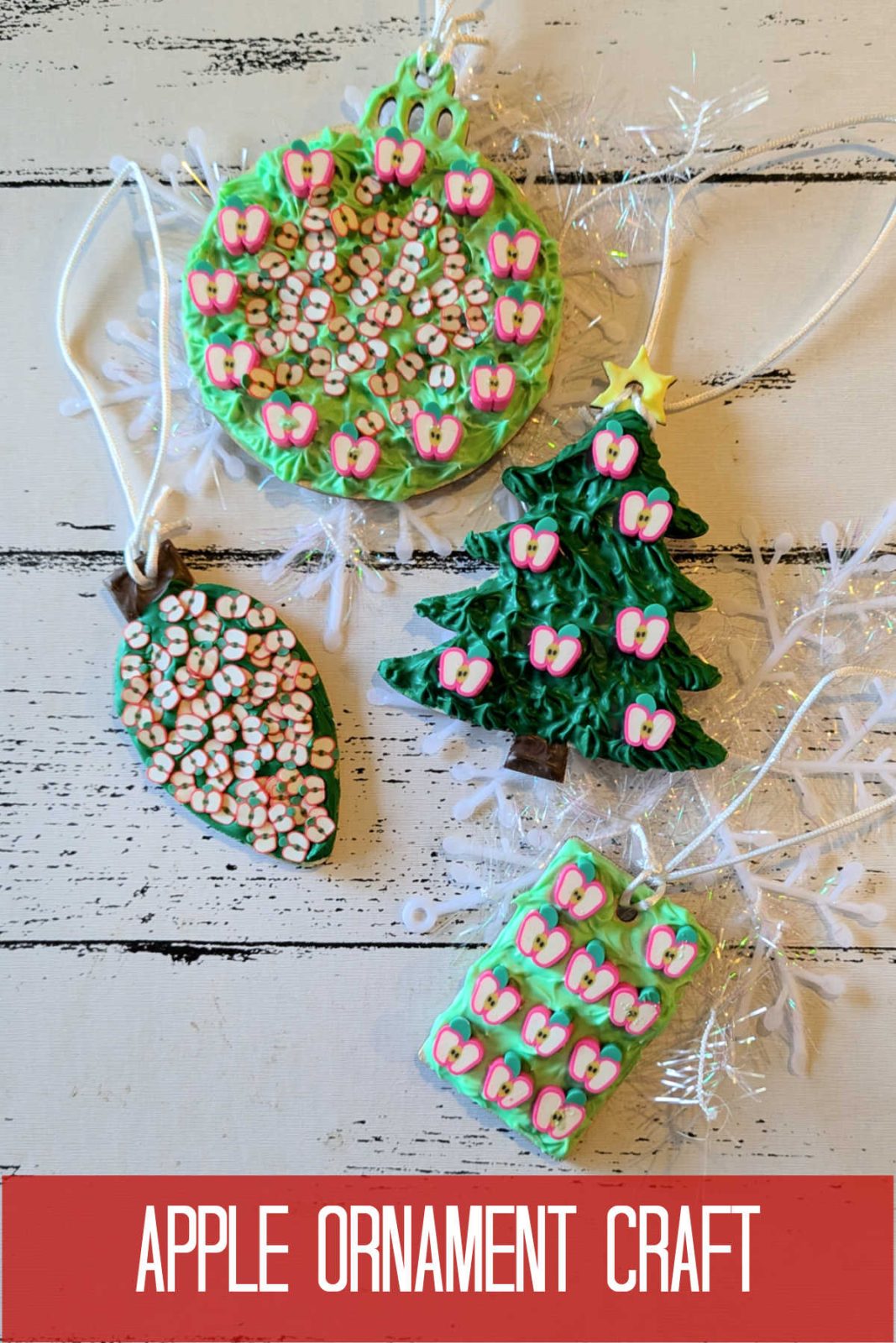 Add a touch of autumn charm to your holiday decor with this DIY Apple Christmas Ornament! The easy craft uses cream glue, apple decorations, and your creativity to create a unique and festive ornament. This is a perfect little gift for teachers, friends, and family.