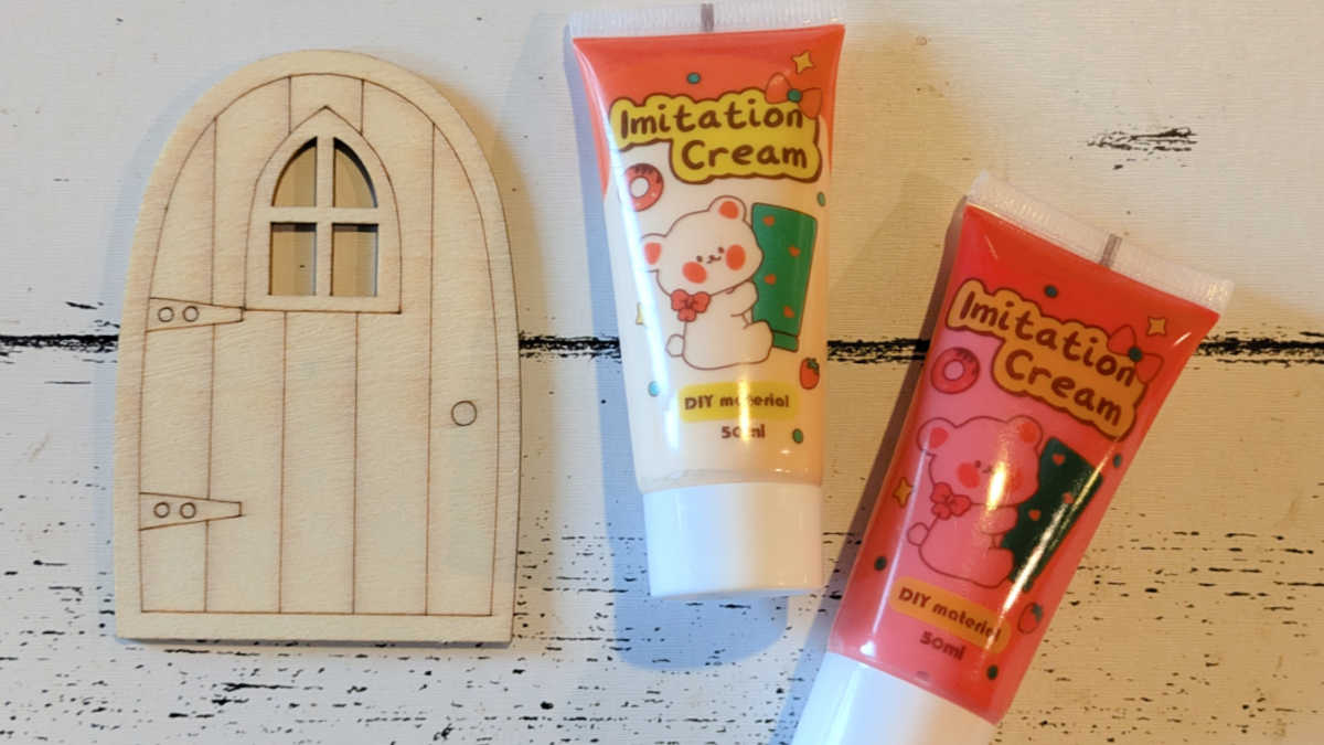 cream glue tubes and fairy door