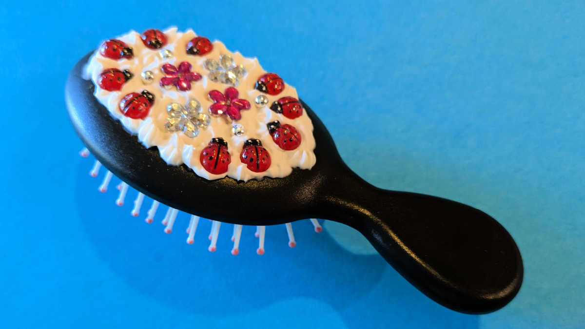 diy hair brush with ladybug decorations