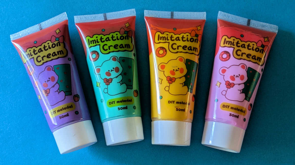 four whipped cream glue tubes