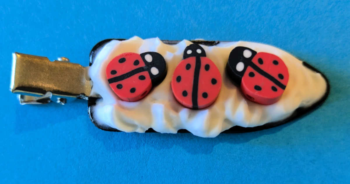 hair clip with ladybugs on it