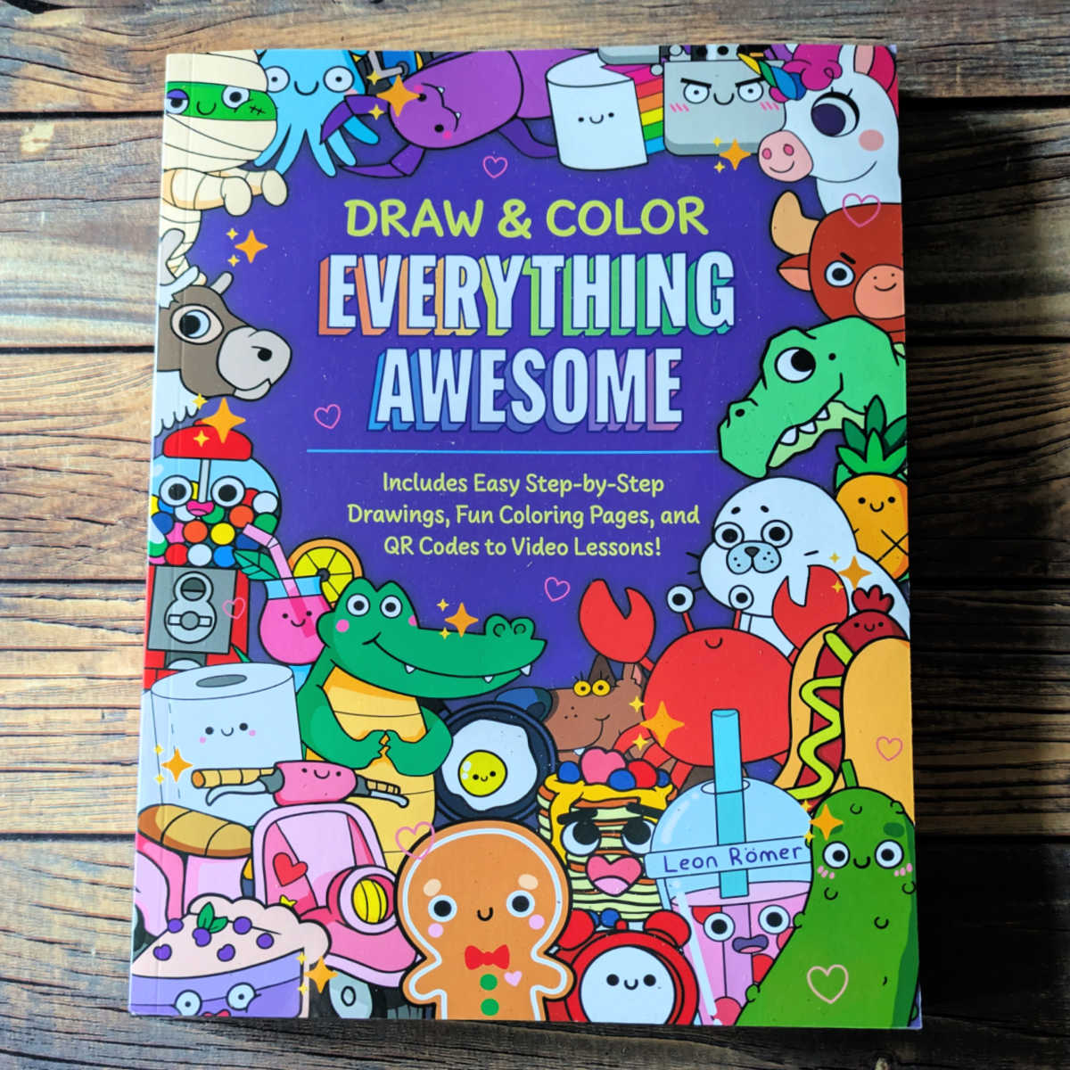 Learn to draw 100+ supercute kawaii things with easy step-by-step tutorials in Draw and Color Everything Awesome! The how to book is perfect for beginner artists and kids and it includes coloring pages & video tips!