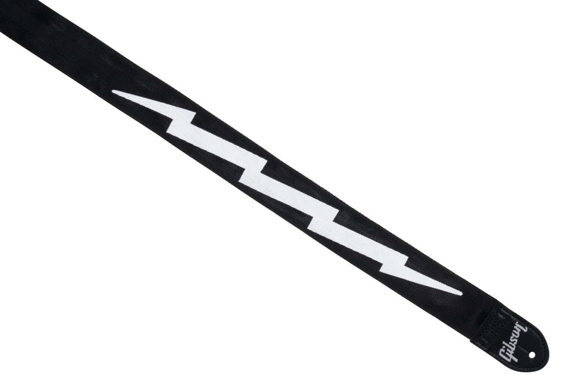 Get a fun and durable strap with the Gibson Lightning Bolt Seatbelt Guitar Strap! It features the classic lightning bolt design and is made from strong, adjustable nylon - the good gift for any guitar player. ⚡