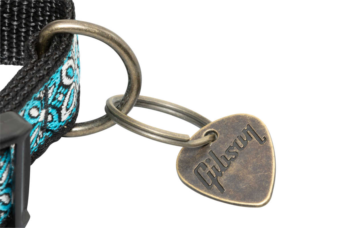 This cute, Gibson brand dog collar looks like a handcrafted guitar strap and includes a fun Gibson guitar pick tag.  It's available in blue and pink, and three sizes and is a great gift for music and dog lovers! 🎸🐾